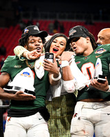 Florida A&M University Head VP and Director of Athletics, Tiffani-Dawn B. Sykes celebrating with the Offensive MVP, Kelvin Dean Jr., and Defensive MVP, Isaiah Major, as Champion Bowl Champions on Dece