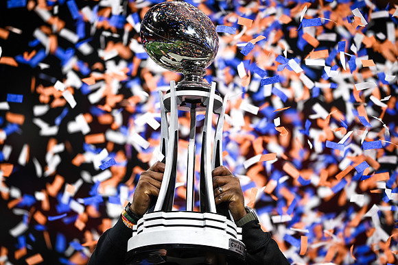 Florida A&M University Head Coach, Willie Simmons hoisting the trophy as the Champion Bowl Champion on December 16, 2023