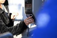 Fan scans her ticket to enter the Band of the Year competition on December 15, 2023